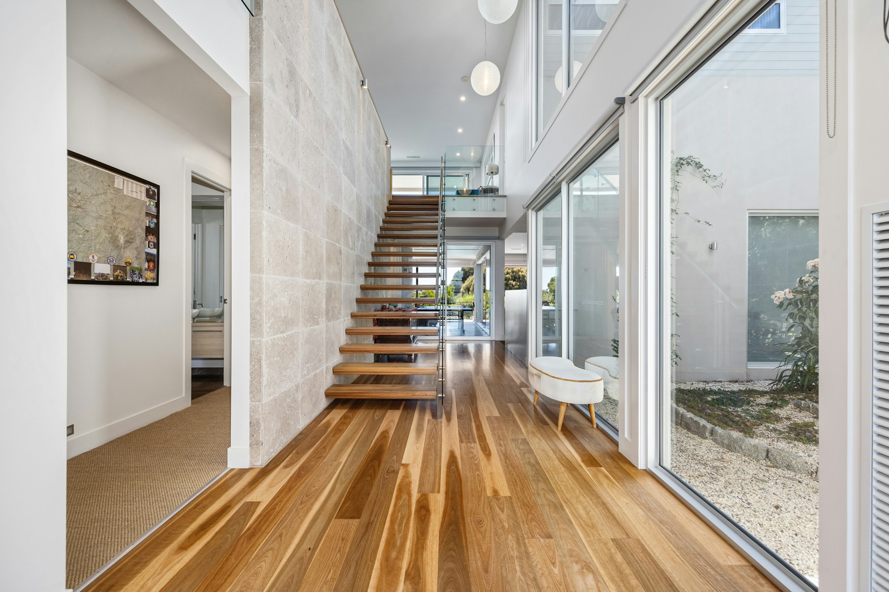 Hardwood flooring and stair transition where detailed repair work may be needed